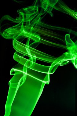 Abstract green smoke . black background clipart