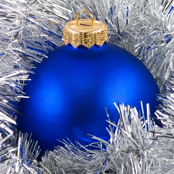 Blue christmas balls in silver garland — Stock Photo, Image