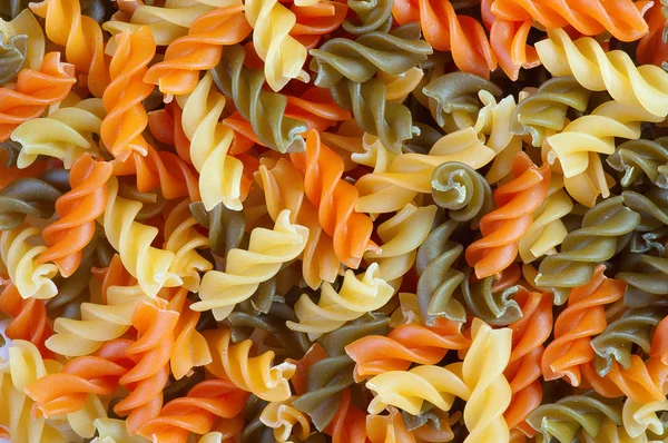 Multicolor spiral macaroni. Close up. — Stock Photo, Image