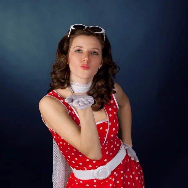 Pretty young girl blowing kiss. — Stock Photo, Image