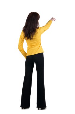 Young woman points at wall. clipart