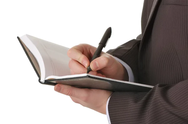 Biznesmen ręce napisać w notatniku — Zdjęcie stockowe