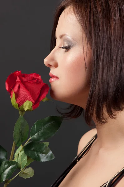 Pretty woman with rose. — Stock Photo, Image