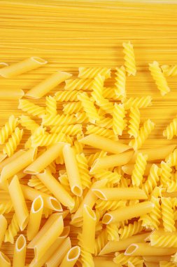 Macaroni on long spaghetti. clipart