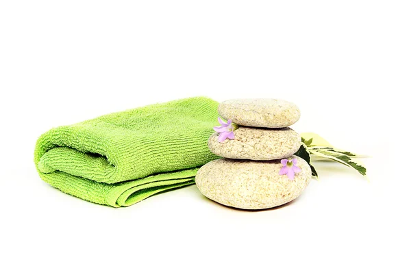 stock image Green towel and stones