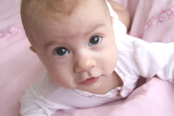 Beautiful baby with curious eyes — Stock Photo, Image