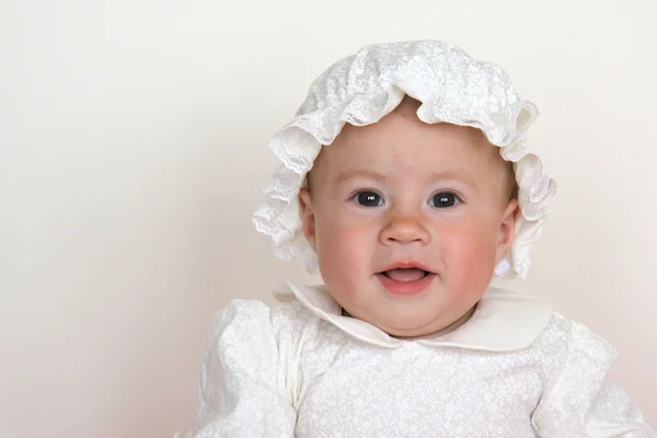Baby girl in christening dress Stock Photo
