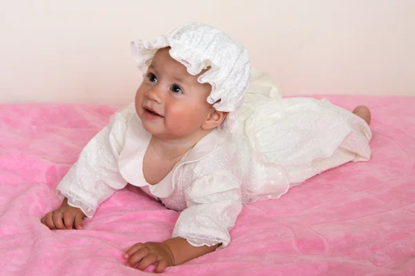 Baby girl in christening dress Stock Picture