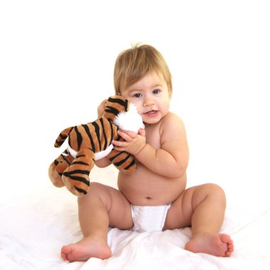 Cute toddler hugging tiger toy clipart