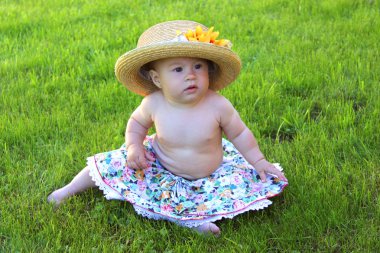 Baby girl wearing big hat clipart