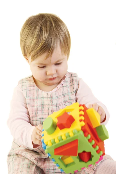Baby girl with colorful sorter toy — Stock Photo, Image