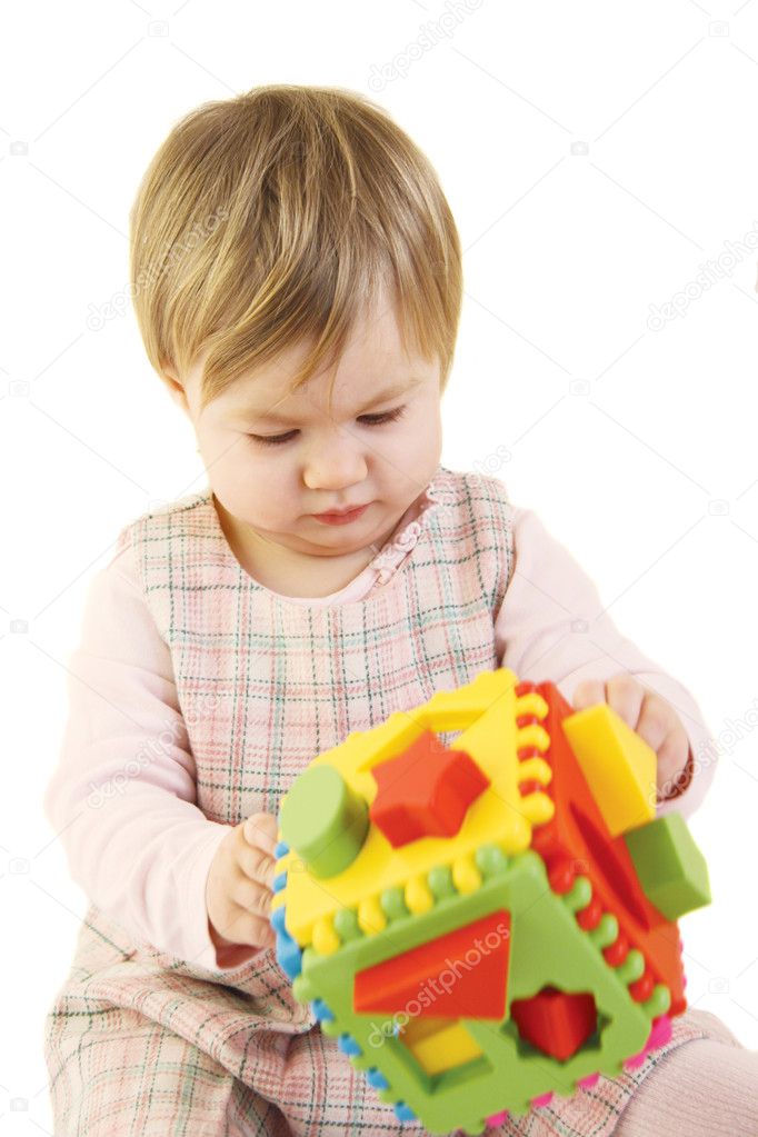 Baby girl with colorful sorter toy