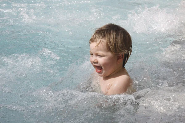 Little baby girl swimming in jacuzzi — Stock Photo, Image