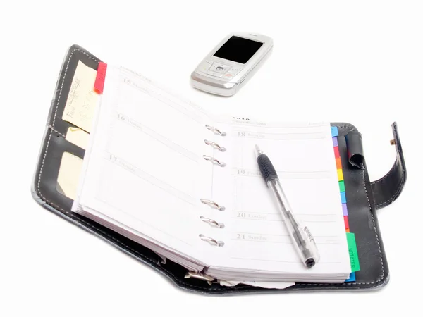 Pen dagbok och en mobiltelefon — Stockfoto