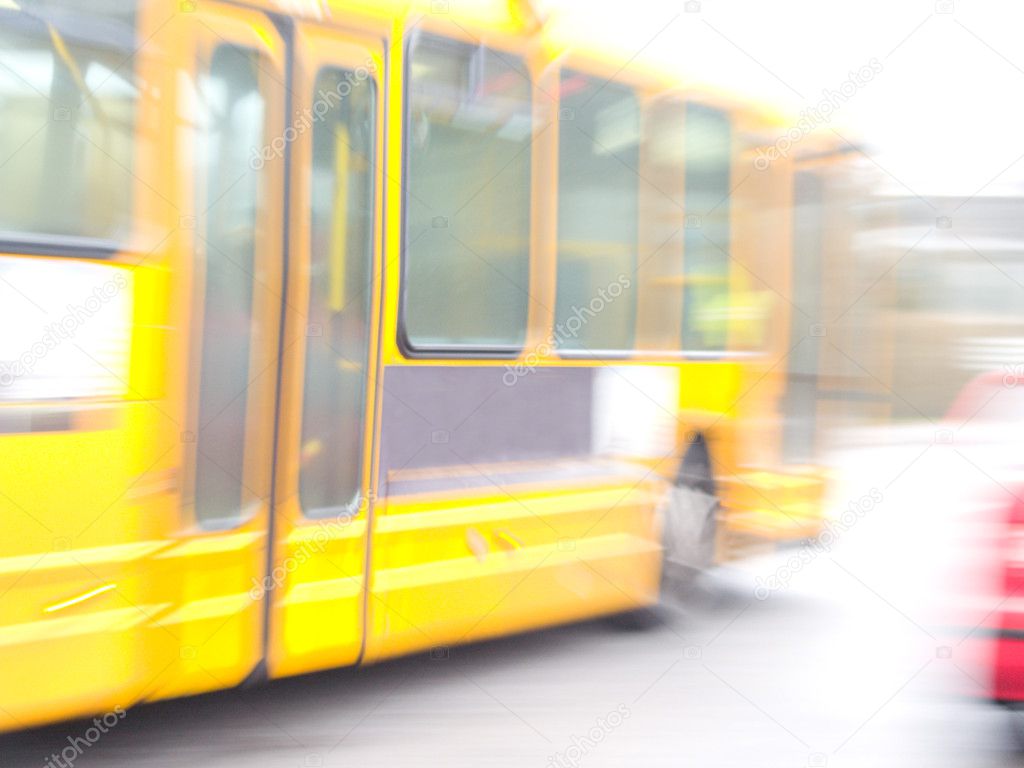 Motion Blur of a Yellow bus driving