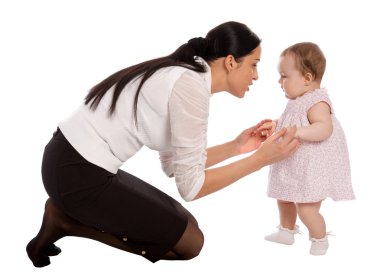 A mother teaches his daughter to walk clipart