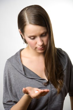 Young women with tablets in hand. clipart