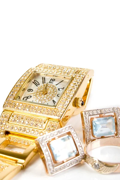 Gyllene klocka och smycken — Stockfoto