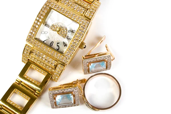 Golden clock and jewellery — Stock Photo, Image