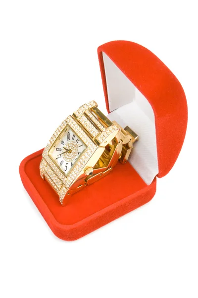 Relógio dourado em caixa vermelha — Fotografia de Stock