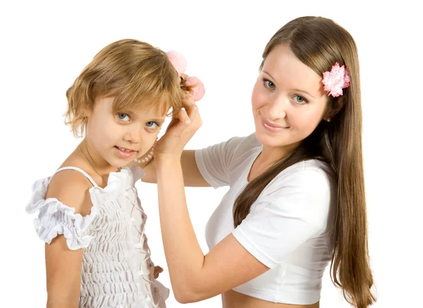 Mother helps her daughter with her hairs — Stock Photo, Image