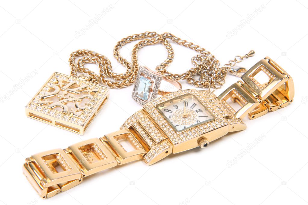 Golden watch, ring and necklace.