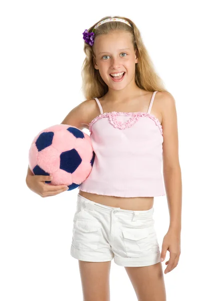 Молодая красивая девушка с игрушечным футбольным мячом — стоковое фото
