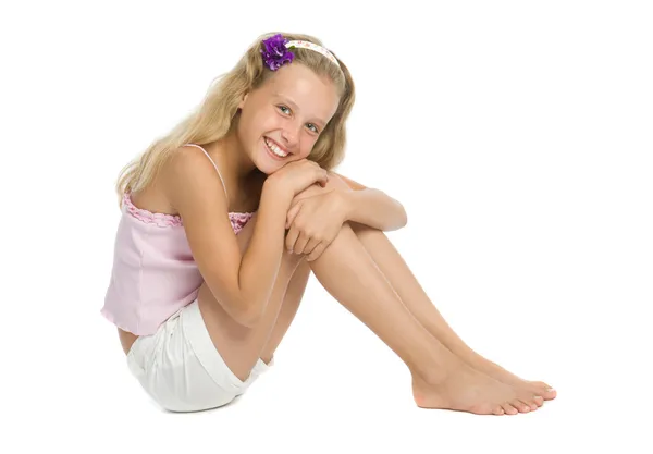 Pretty teenage girl sit on floor Stock Picture