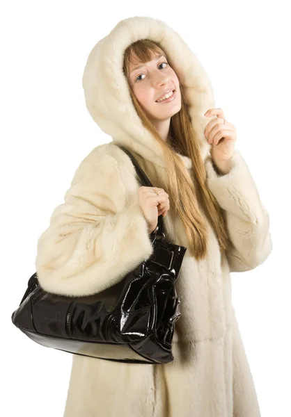 Young girl in fur jacket taking bag — Stock Photo, Image
