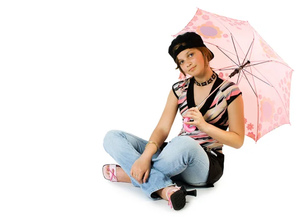 Jong meisje met paraplu zit op verdieping — Stockfoto