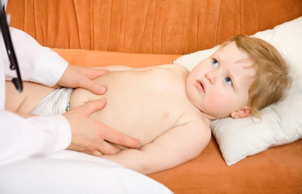 stock image Doctor pediatrician exam baby abdomen