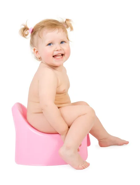 Mooie baby en roze potje — Stockfoto