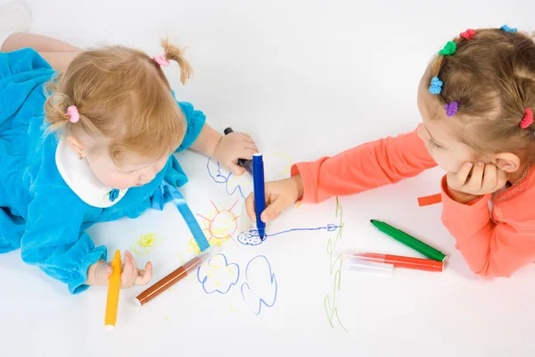 Two little girl painting Stock Image