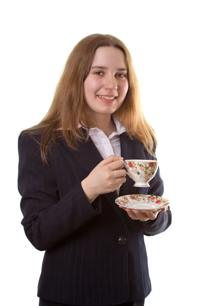 Chica joven con una taza de té — Foto de Stock