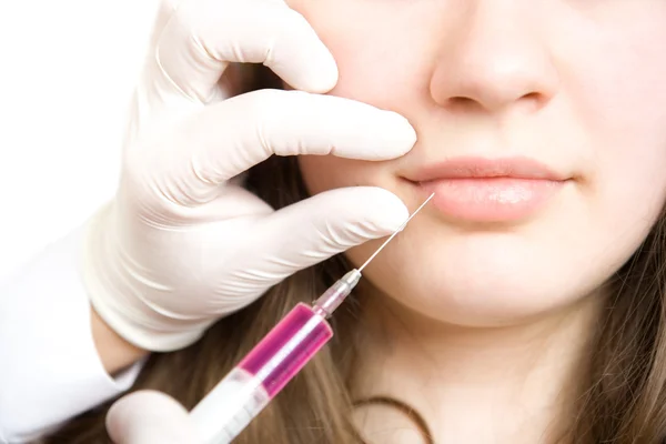 Doctor making injection in women lips — Stock Photo, Image