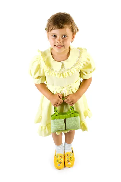Pequena menina sorridente com saco verde . — Fotografia de Stock