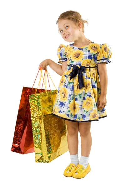 Liten flicka med shopping väska. — Stockfoto