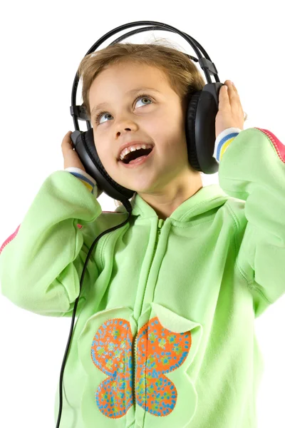 Piccola ragazza divertente ascoltare musica — Foto Stock