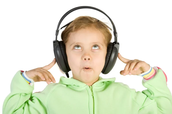 Verrast meisje luisteren muziek — Stockfoto