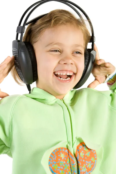 Beetje leuk meisje luisteren muziek — Stockfoto