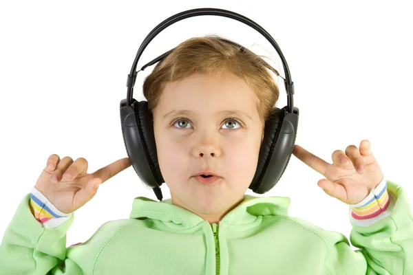 Förvånad tjej lyssnar musik — Stockfoto