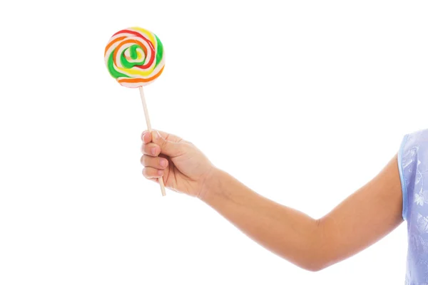 Färgen lollipop i barnets hand — Stockfoto