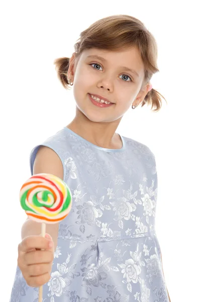 Девушка с цветным леденцом в руке — стоковое фото