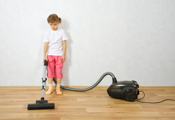 Little girl with vacuum cleaner — Stock Photo, Image