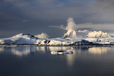 The mountains and their reflection clipart