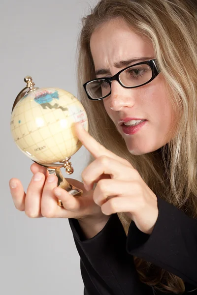 stock image The girl has control over the globe