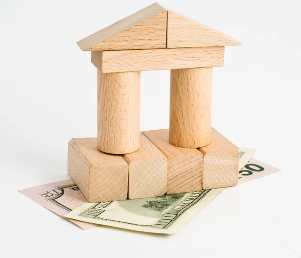 Wooden blocks and money — Stock Photo, Image