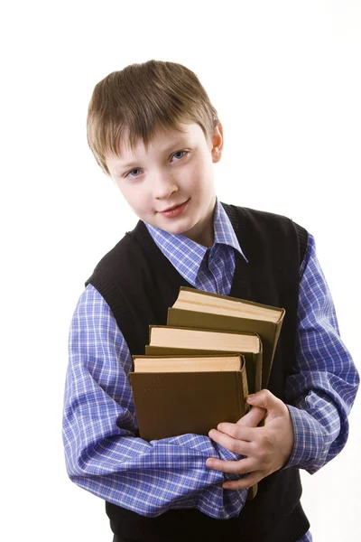 Chłopiec z stos książek — Zdjęcie stockowe