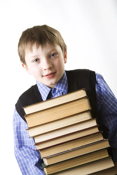 Chłopiec z stos książek — Zdjęcie stockowe