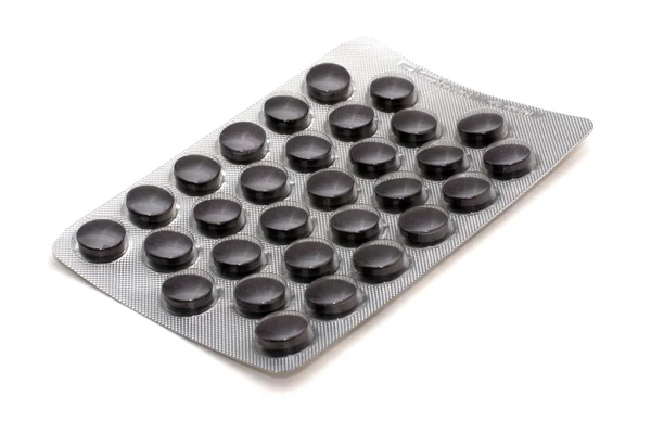 Fekete tabletták — Stock Fotó